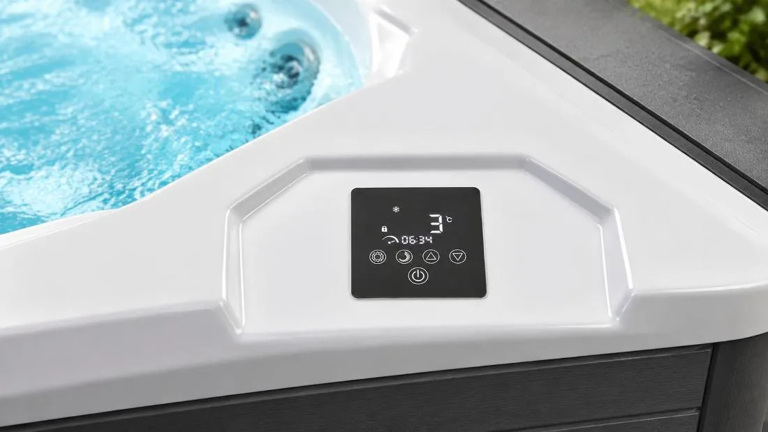 Digital Touchscreen Temperature Controller Built-in digital touch control panel on white acrylic tub ledge displaying water temperature and operational icons