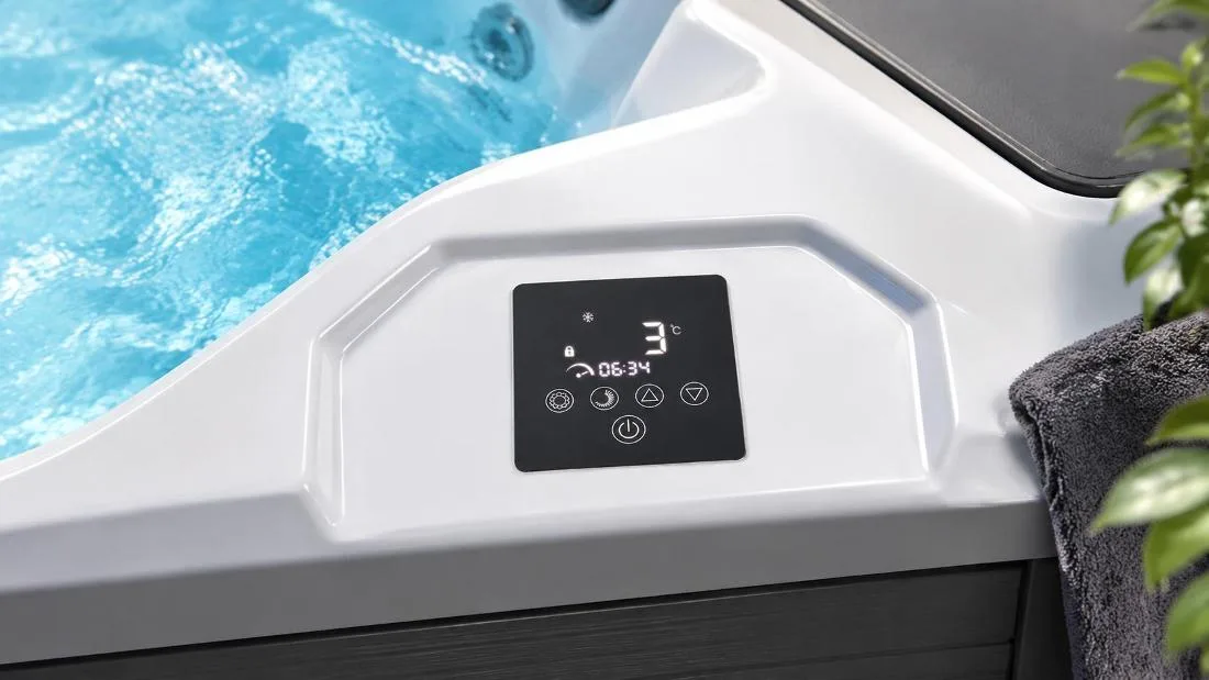 Digital Touchscreen Control Panel on OF-CP01 Plunge Tub Close-up top-down view of the built-in digital touch control panel on the white acrylic tub ledge displaying cooling status and timer