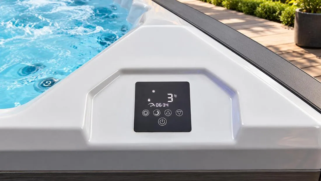 Digital Touch Control Panel Close-up top-down view of the built-in digital touch control panel on the smooth white acrylic tub ledge, showing the 3°C readout, timer, and tactile function icons.