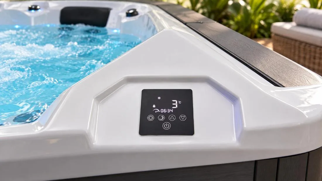 Digital touch control panel displaying temperature and timer settings Top-down close-up view of the digital touch control panel on white acrylic tub ledge